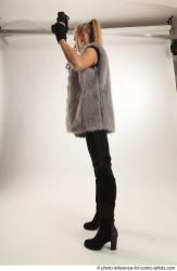 NIKOL STANDING POSE WITH TWO GUNS